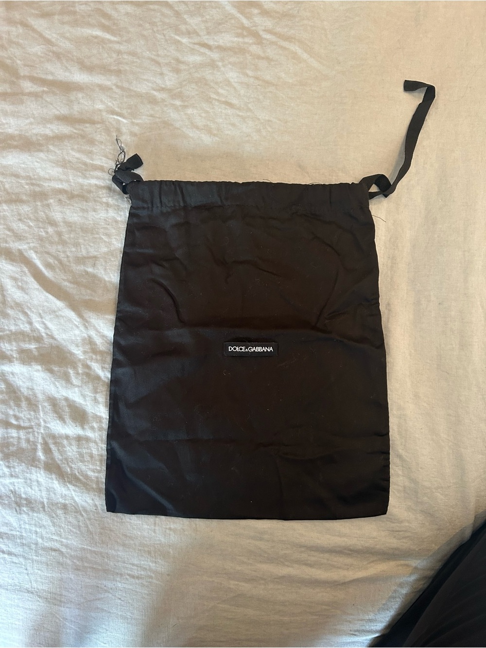 Black Dolce and Gabbana Sleeper dust bag.